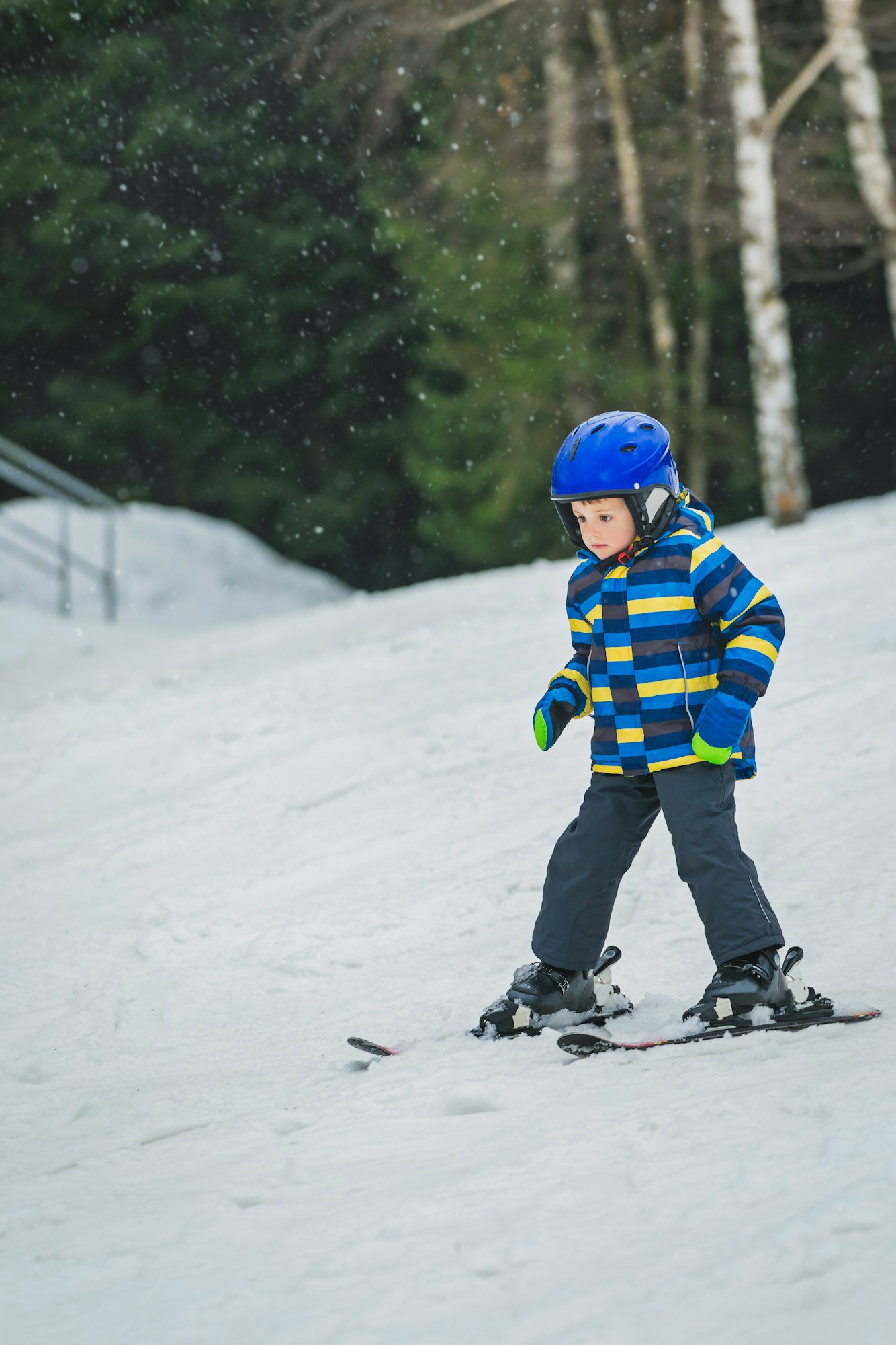 Little boy skiing for the first time